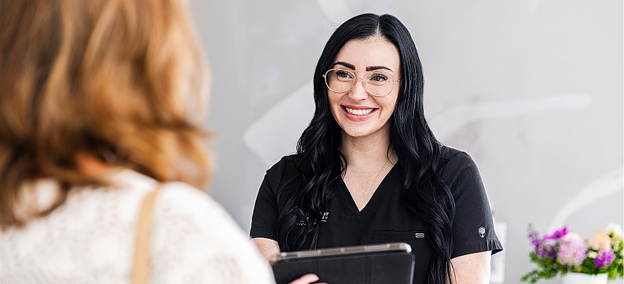Smiling professional consultant engaging with a client.