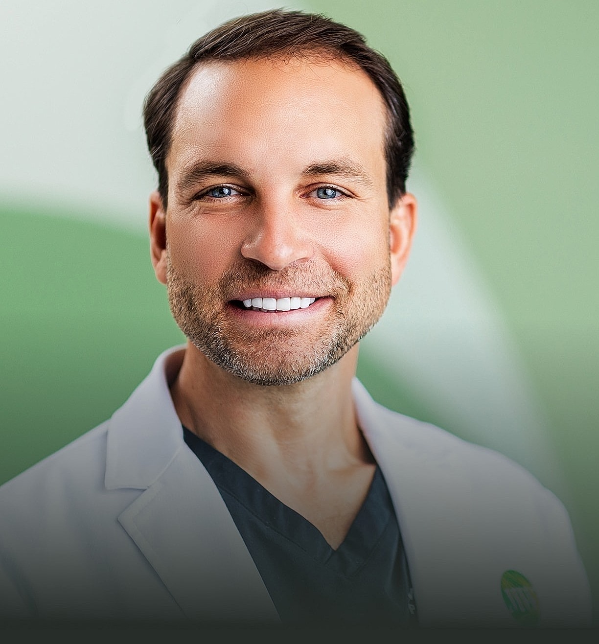 Smiling doctor in a white coat portrait.