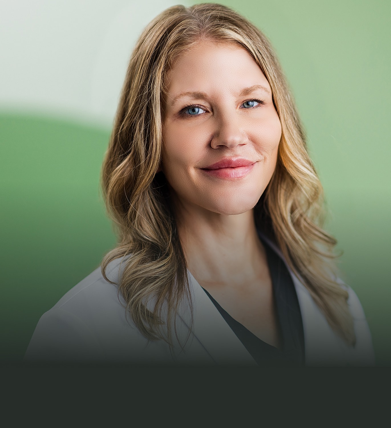 Smiling professional in a medical setting.