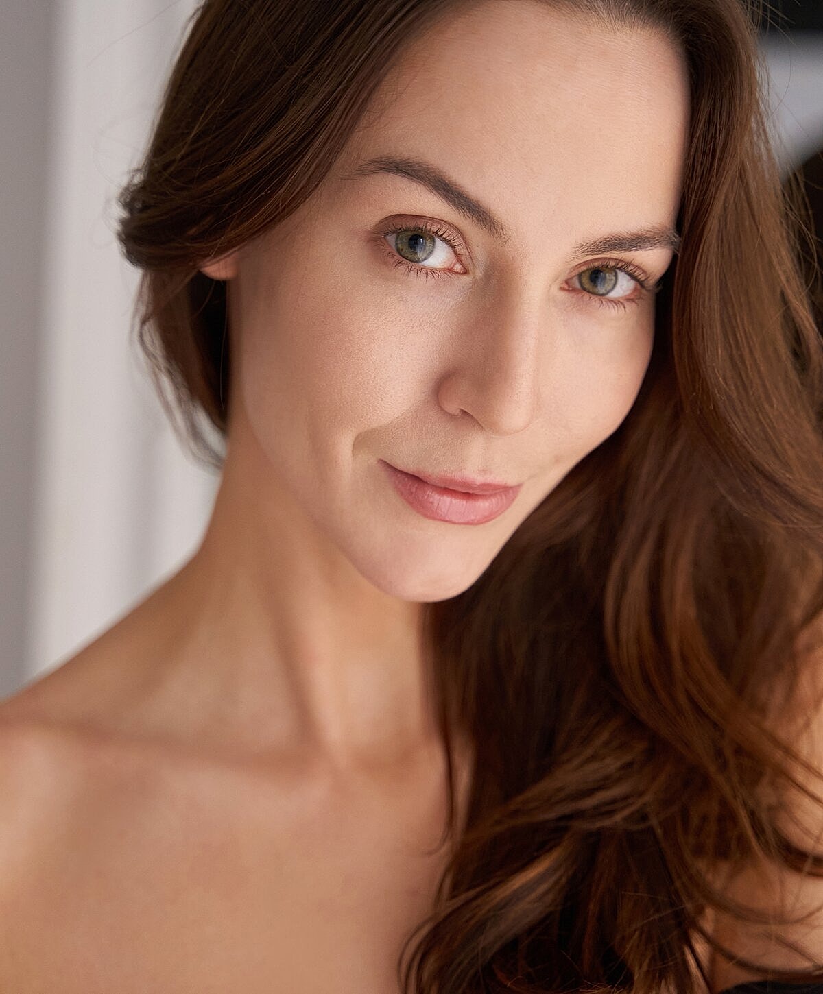Modern seating area with blue chairs and greenery.