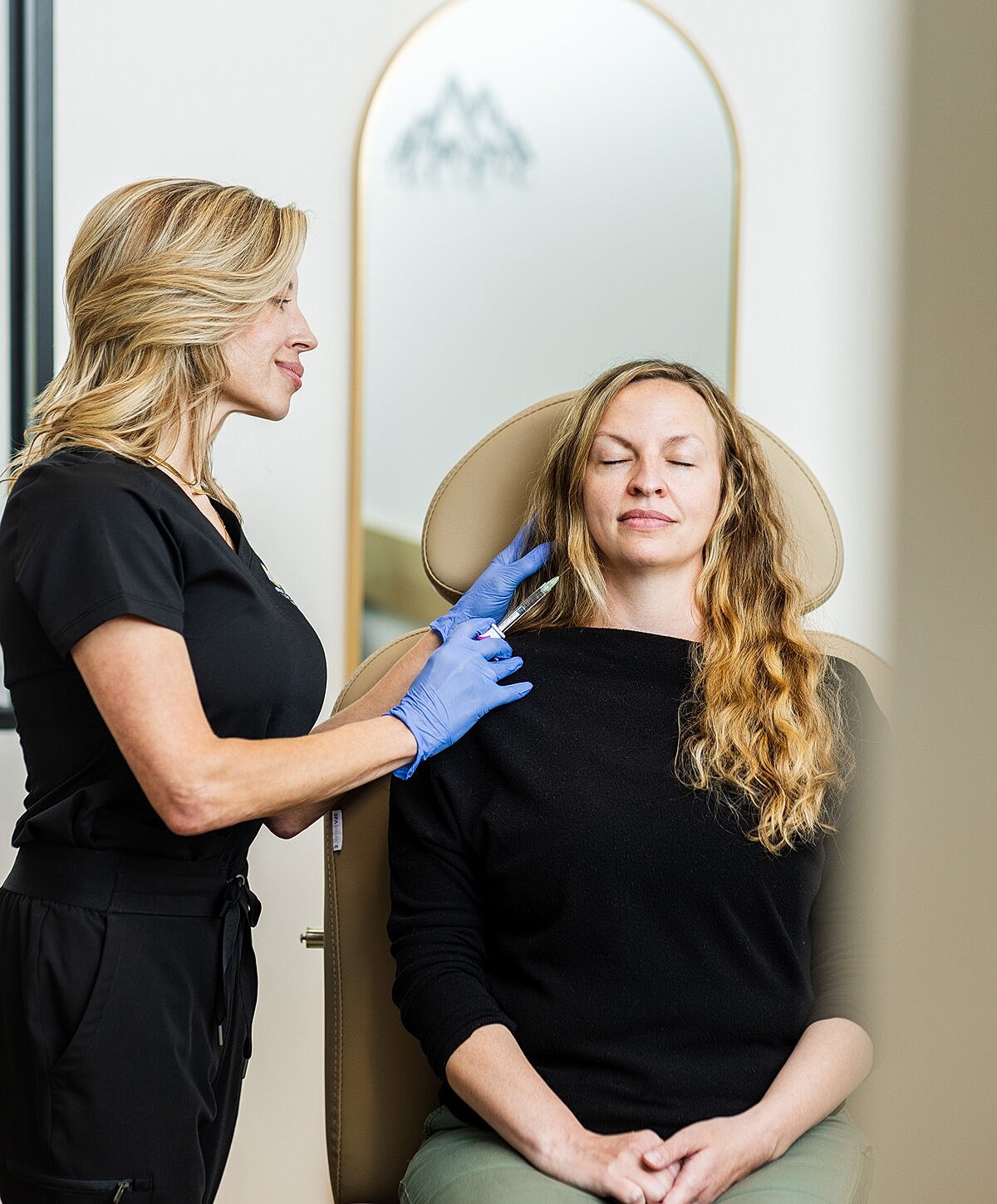 Consultation for aesthetic treatment in clinic setting.