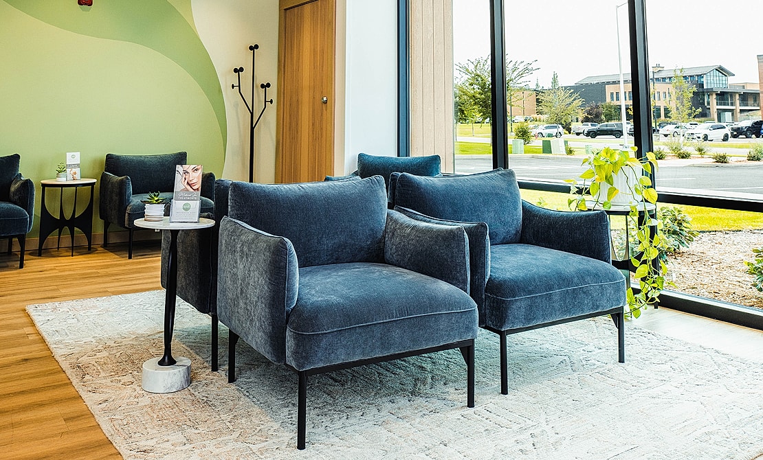 Modern living space with stylish blue chairs