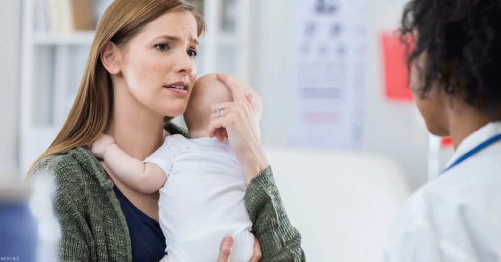 Concerned mother getting information from doctor about cleft palate surgery in Montana